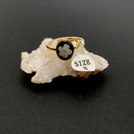 Size 8- Gold - Small White Flower on Black Ring